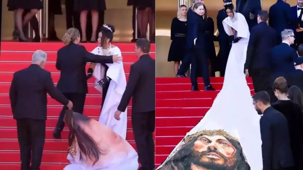 A atriz e miss República Dominicana Massiel Tavera reage quando a mesma francesa a empurra para sair do tapete vermelho do Festival de Cannes
